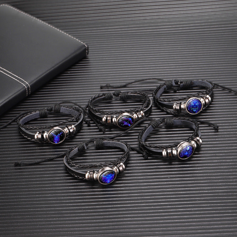 deep blue astrology charm bracelet worn casually by young woman