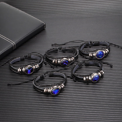 deep blue astrology charm bracelet worn casually by young woman