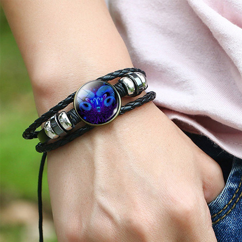 gift-ready astrology bracelet held in hand with constellation visible